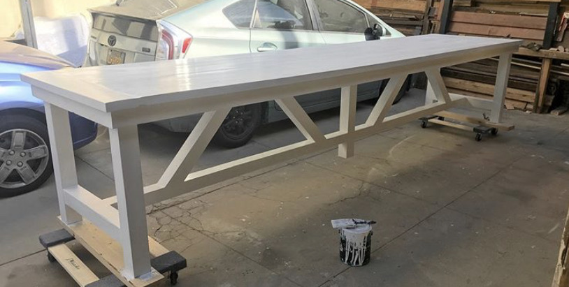 Farmhouse Table — Painted hardwood · cross-braced trestle